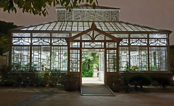 The royal greenhouse of Changgyeonggung lit up at night.