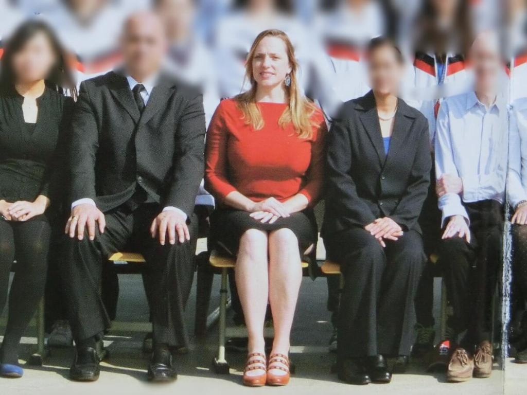 A class photograph of teachers at a school in China.