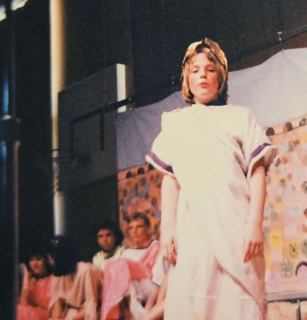 Photo of a young 14 year old Adrienna performing as Caesar in the production of Androcles and the Lion.