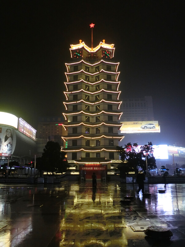A photograph of Erqi Tower in Erqi Square in Zhenzhou, China.